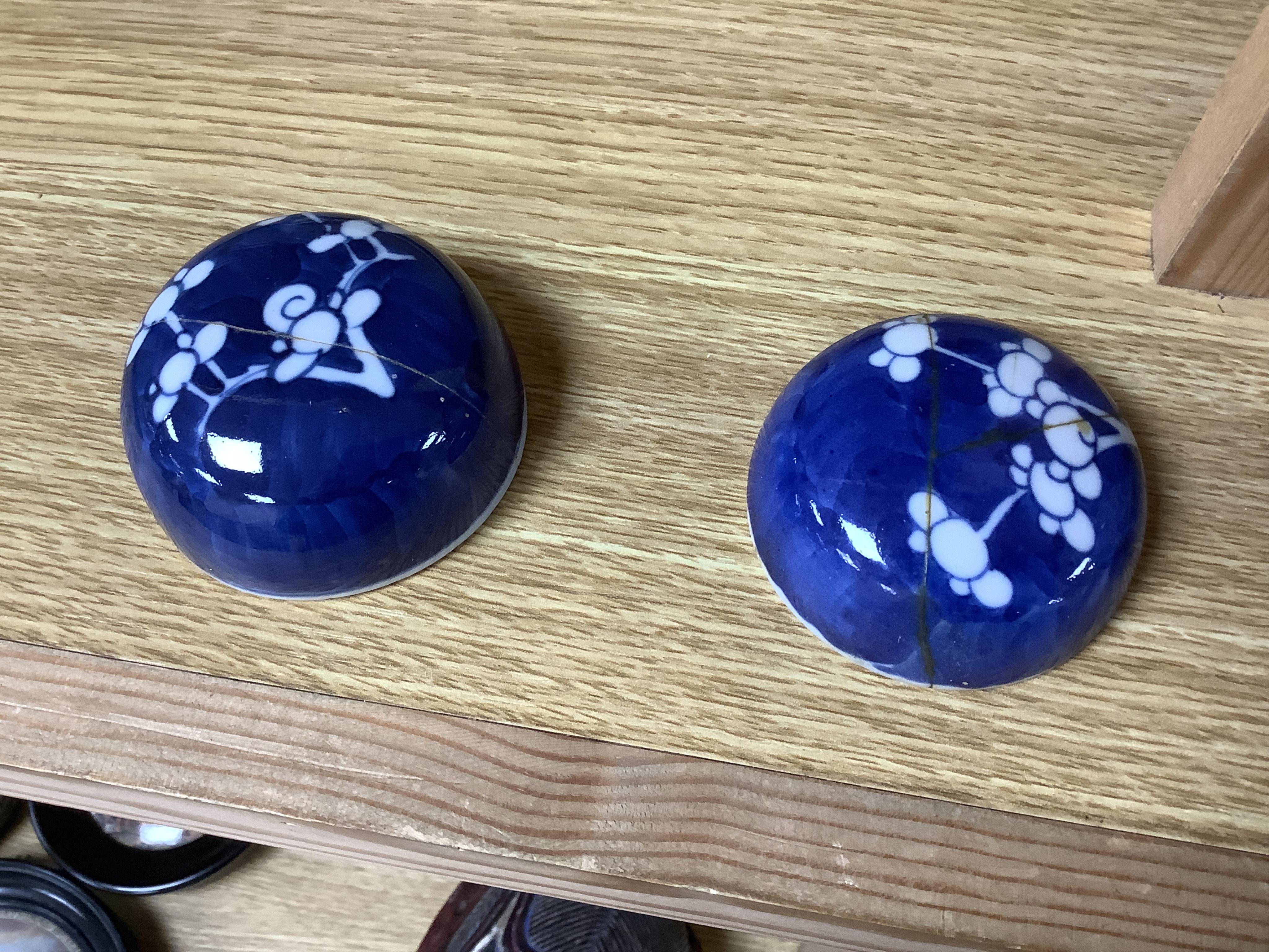 Eleven Chinese blue and white prunus jars and two covers, late 19th/20th century, tallest jar and cover 15cm high.